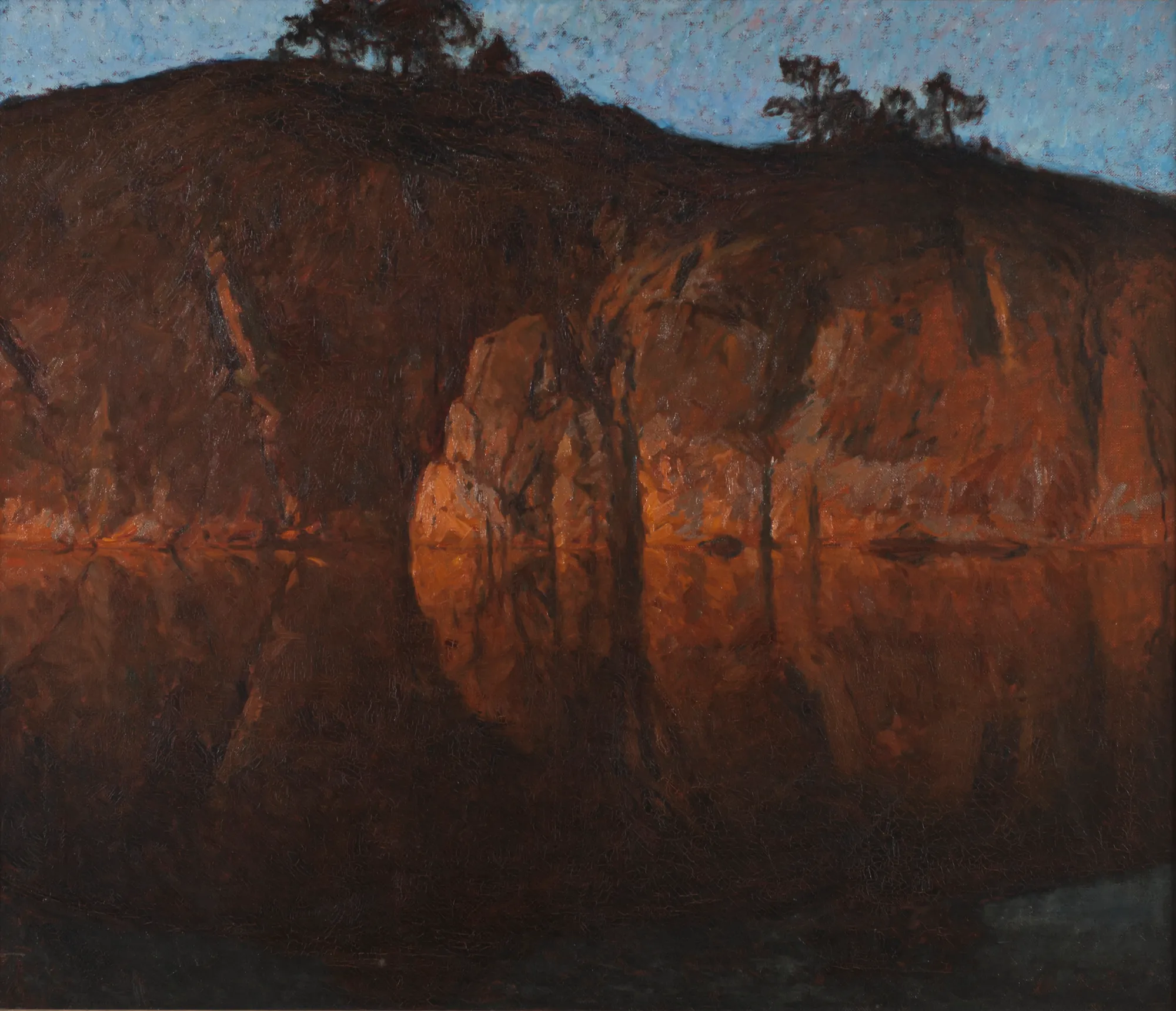 After Sunset: Motif from the Archipelago After Sunset: Motif from the Archipelago by Gottfrid Kallstenius. A dark, rocky shoreline is reflected in the mirror-like surface of still water under a pale blue twilight sky.