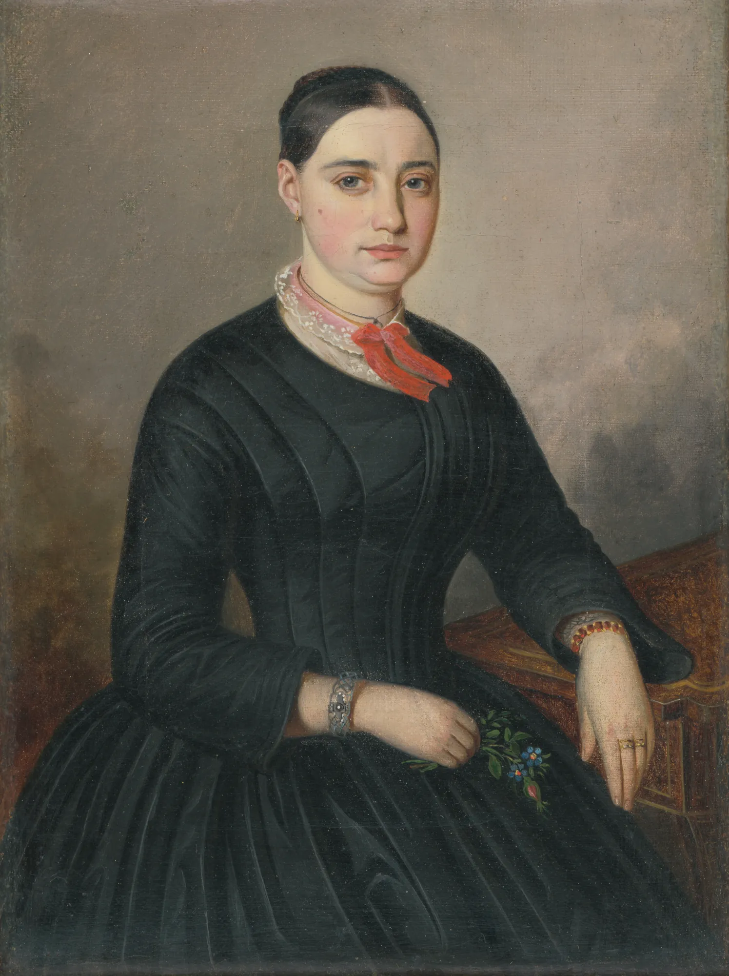 Portrait of Johanka Tramplová Portrait of Johanka Tramplová by Peter Michal Bohúň. A three-quarter length oil portrait of a woman in a dark high-necked dress with a red bow, seated beside a writing desk.