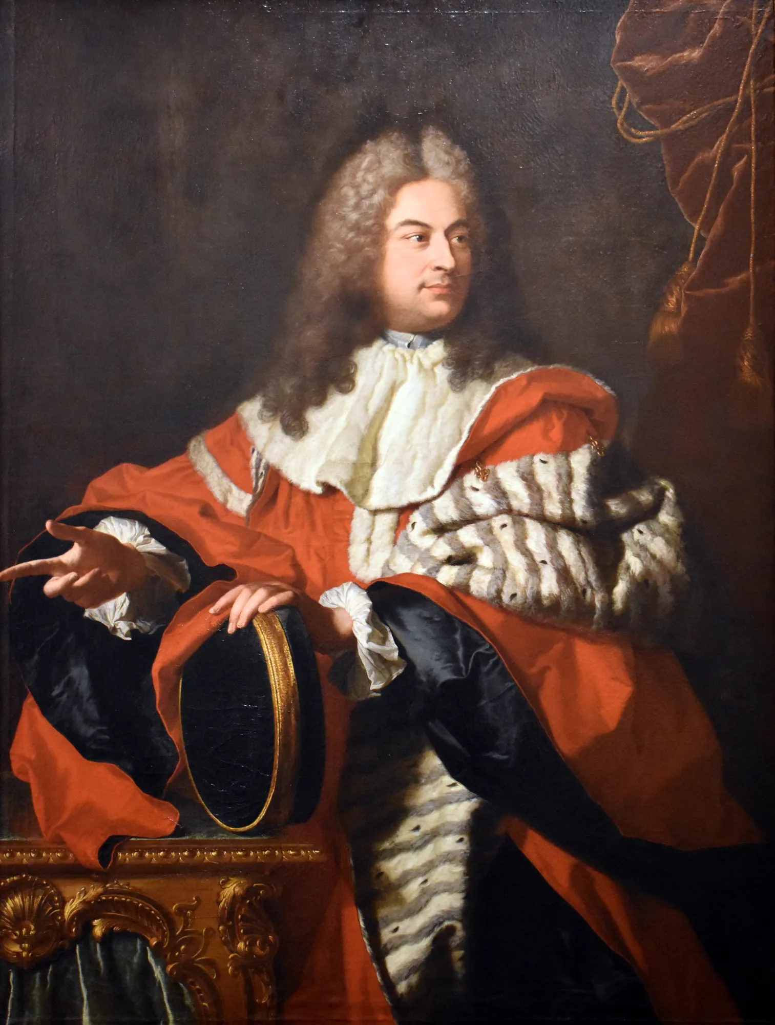 Gaspard de Gueidan Gaspard de Gueidan by Hyacinthe Rigaud. A formal three-quarter length portrait of a man in ornate red and ermine robes, gesturing beside a gilded console table.
