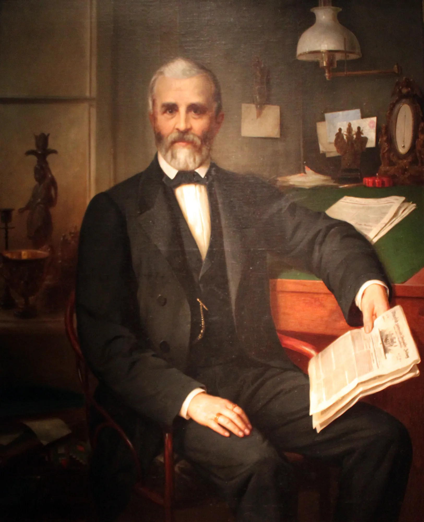 Portrait of Albert Mewes Portrait of Albert Mewes by Hermann Brücke. A formal oil portrait of an older man with a grey beard sitting at a desk and holding a newspaper.