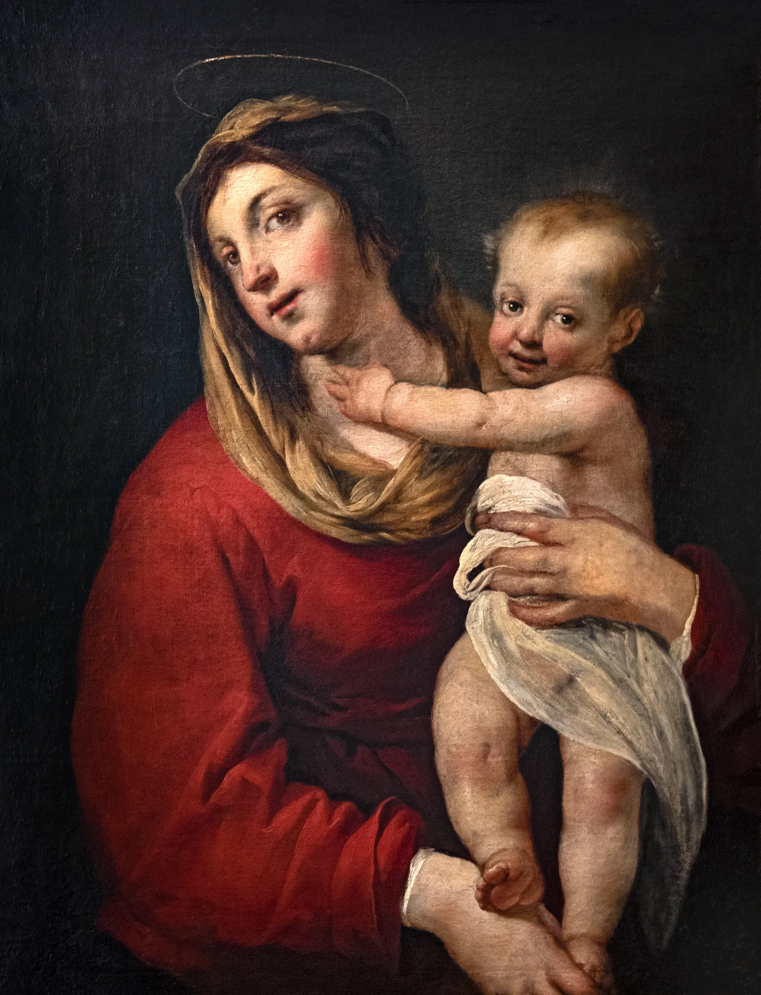 La Vierge à l'Enfant La Vierge à l'Enfant by Jacques Blanchard. An oil painting depicting the Virgin Mary in a red robe holding the infant Jesus against a dark, minimalist background.