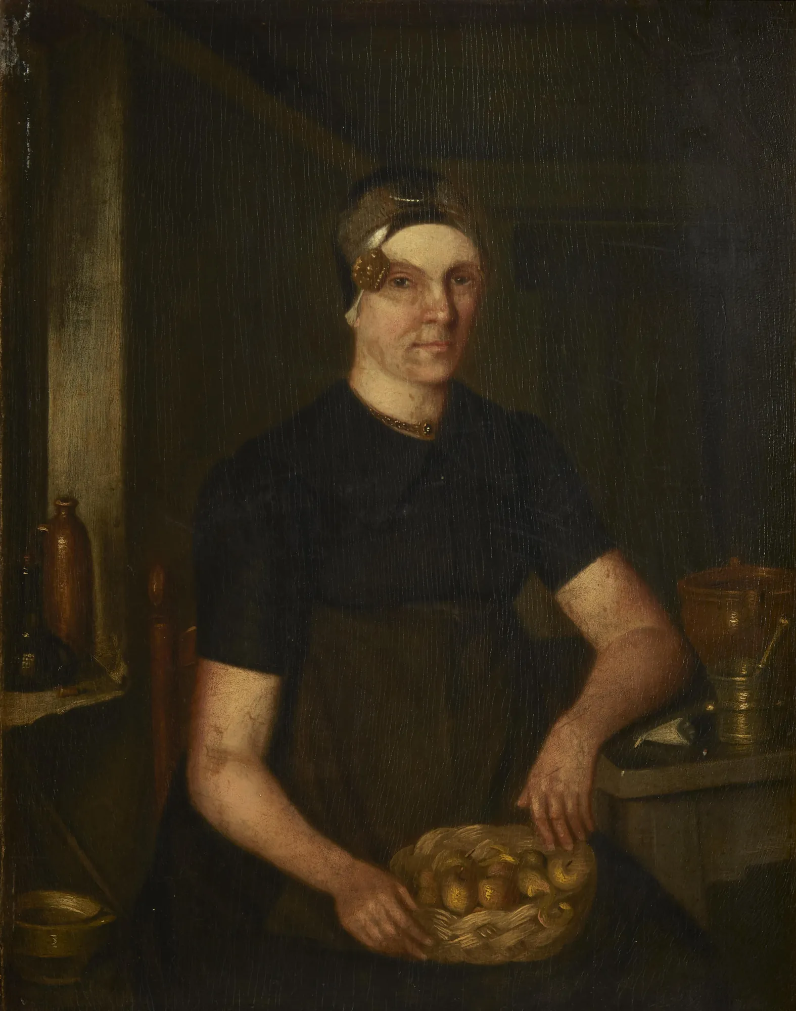 Frisian Woman with an Ear Iron Frisian Woman with an Ear Iron by Unknown Artist. A seated woman in dark clothing and a traditional Frisian headpiece holds a basket of fruit in a dimly lit interior.