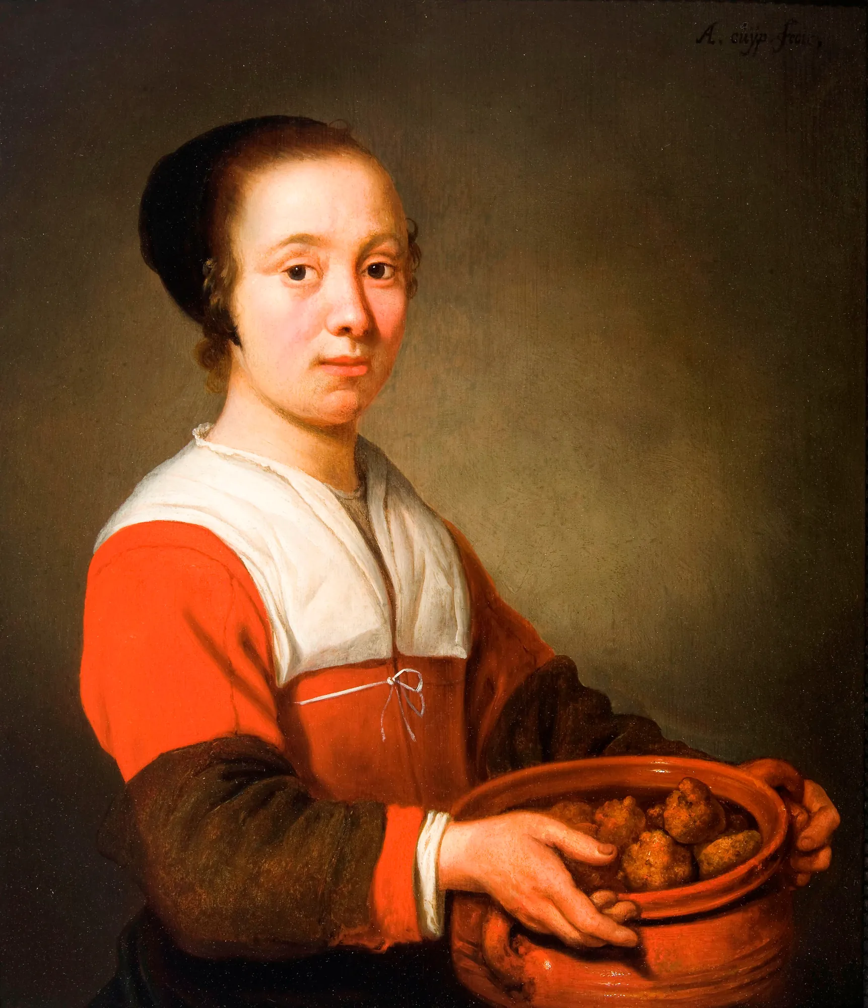 A Woman Holding Oliebol Treats