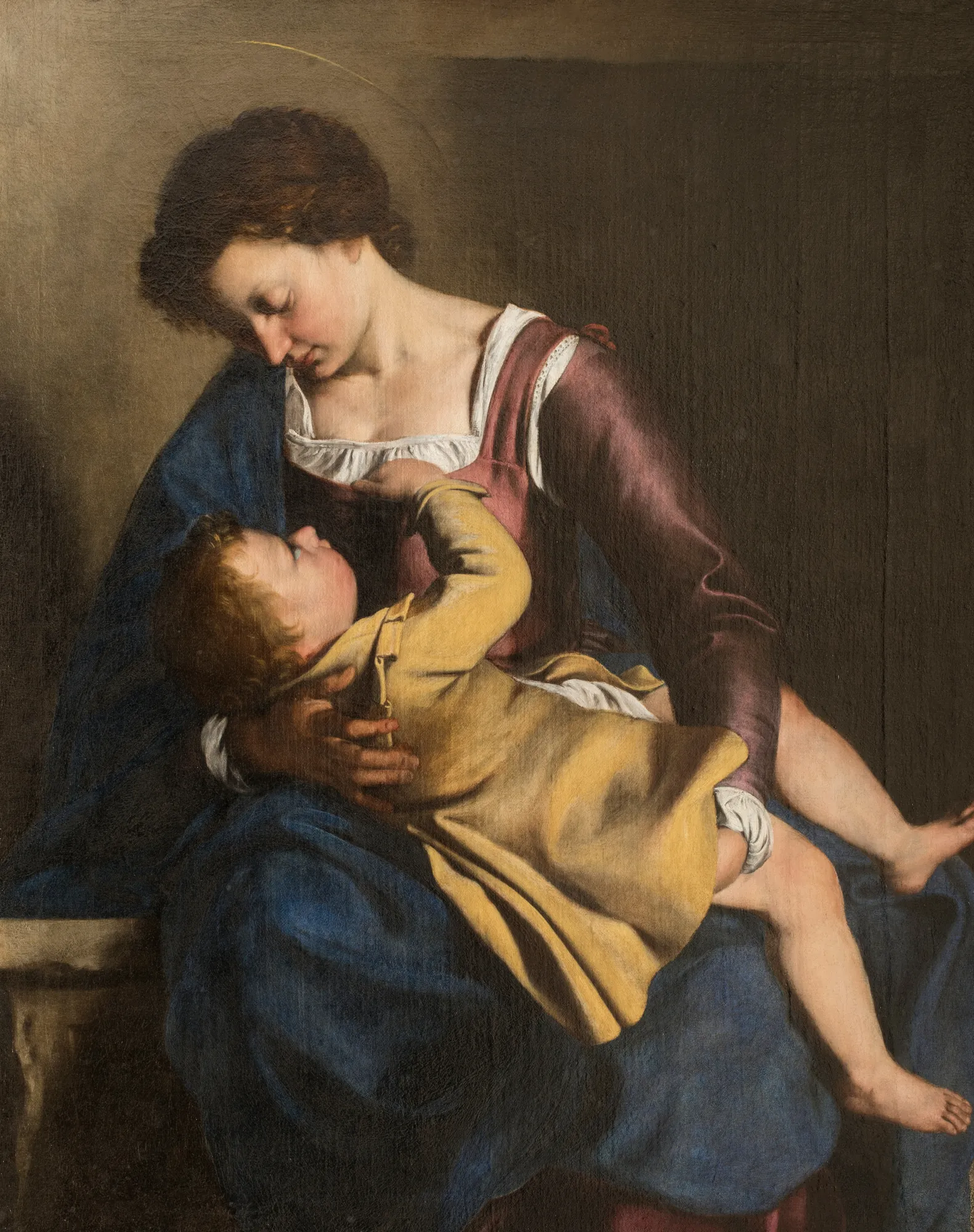 Madonna and Child Madonna and Child by Orazio Gentileschi. A seated woman in a blue mantle and mauve dress holds a small child in a yellow tunic who reaches up towards her.