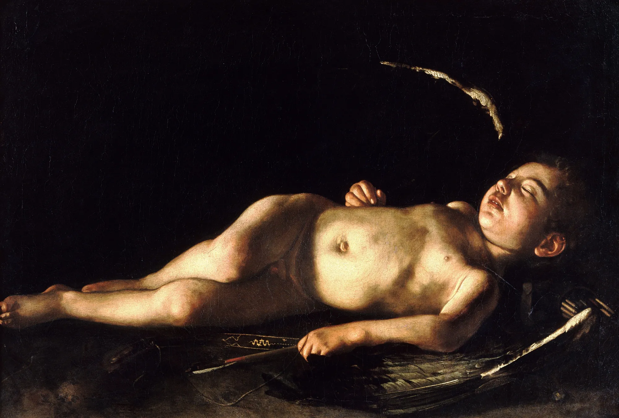 Sleeping Cupid Sleeping Cupid by Caravaggio. A young Cupid is shown sleeping soundly on his bow and arrows, illuminated by a dramatic light source against an absolute black background.