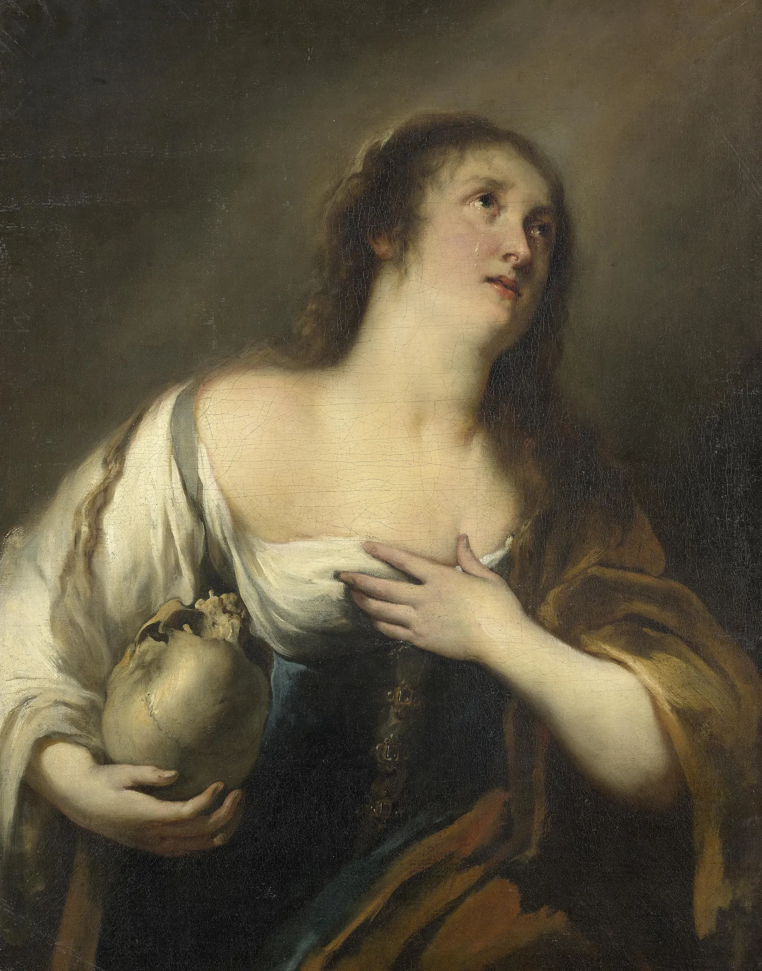 The Penitent Magdalene The Penitent Magdalene by Giovanni Andrea de Ferrari. A tearful portrait of Mary Magdalene looking upward, holding a human skull as a memento mori while resting one hand on her chest.
