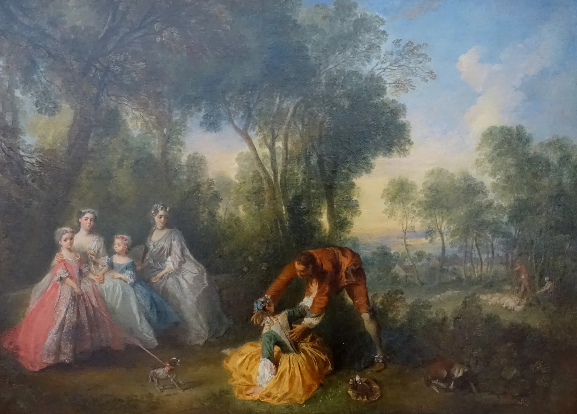Group Portrait in a Landscape with Amorous Couple Group Portrait in a Landscape with Amorous Couple by Nicolas Lancret. An elegant group of figures, including women and children, gather in a wooded parkland while a playful couple interacts in the foreground.