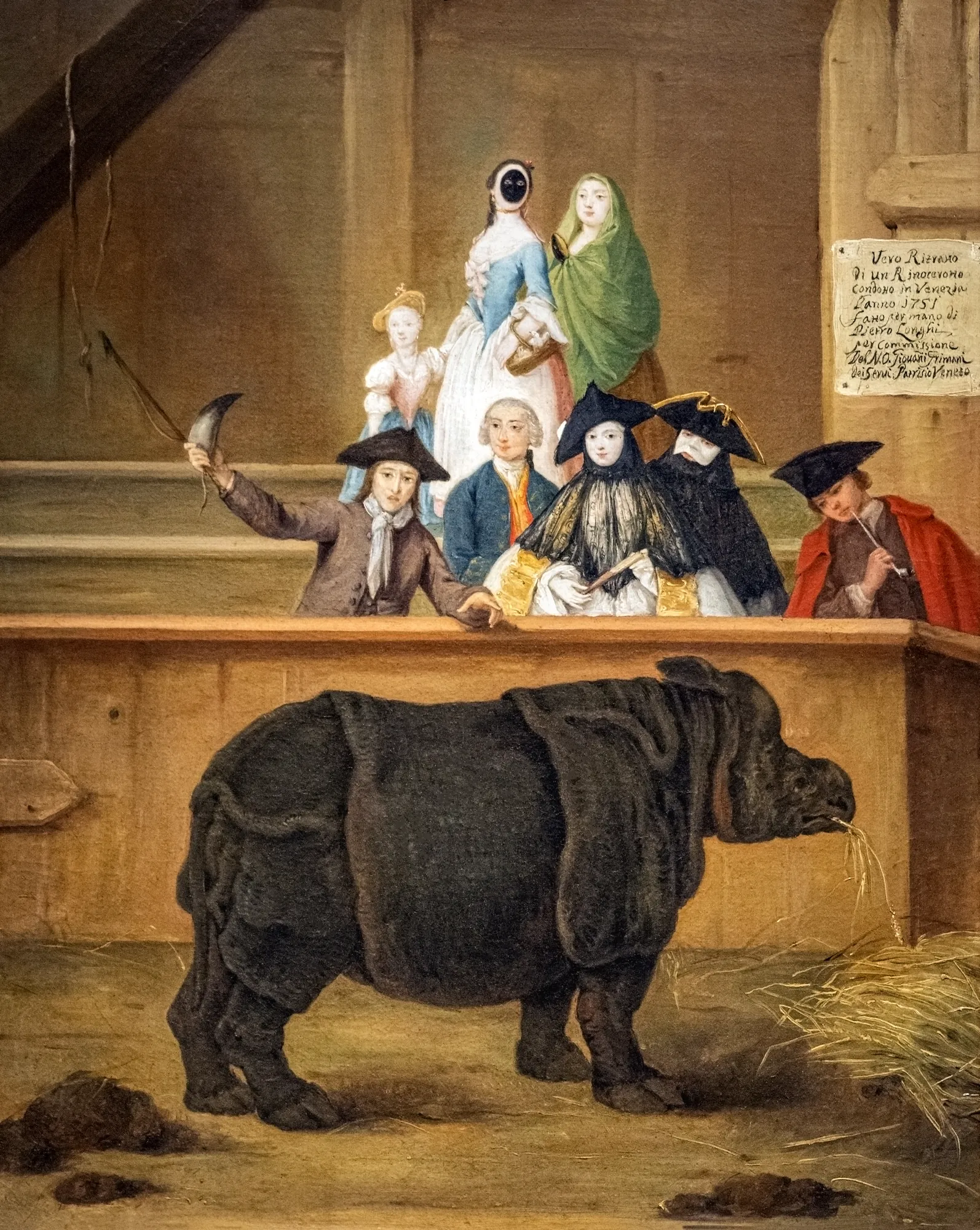 The Rhinoceros The Rhinoceros by Maxime Guibert. A large rhinoceros stands in a straw-strewn enclosure while eighteenth-century spectators in Venetian attire and masks observe from behind a rail.