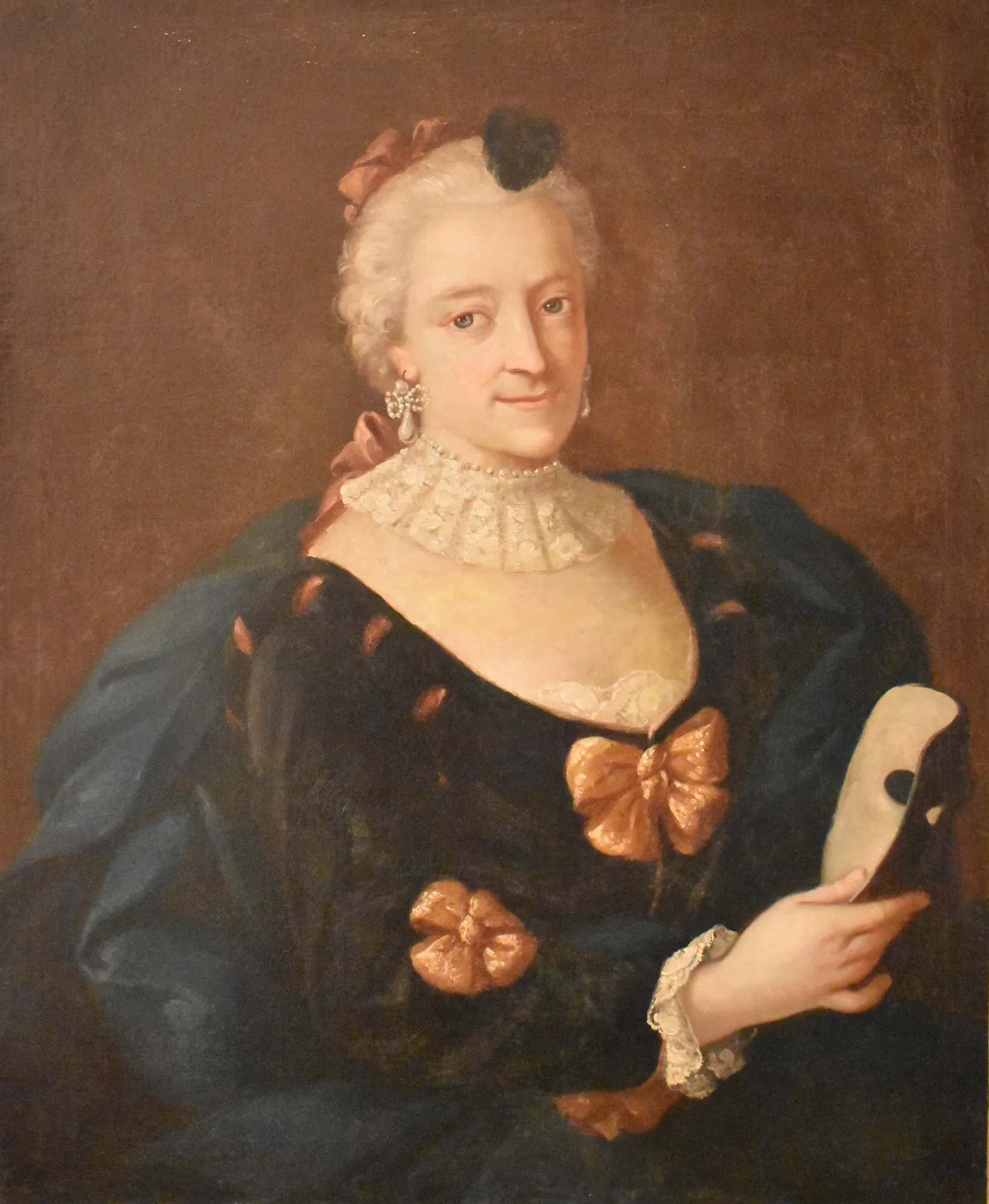 Femme au masque (Woman with a Mask) Femme au masque (Woman with a Mask) by Michel Rabillon. An 18th-century oil portrait of a woman with powdered hair, wearing a dark dress with golden bows and holding a white mask.