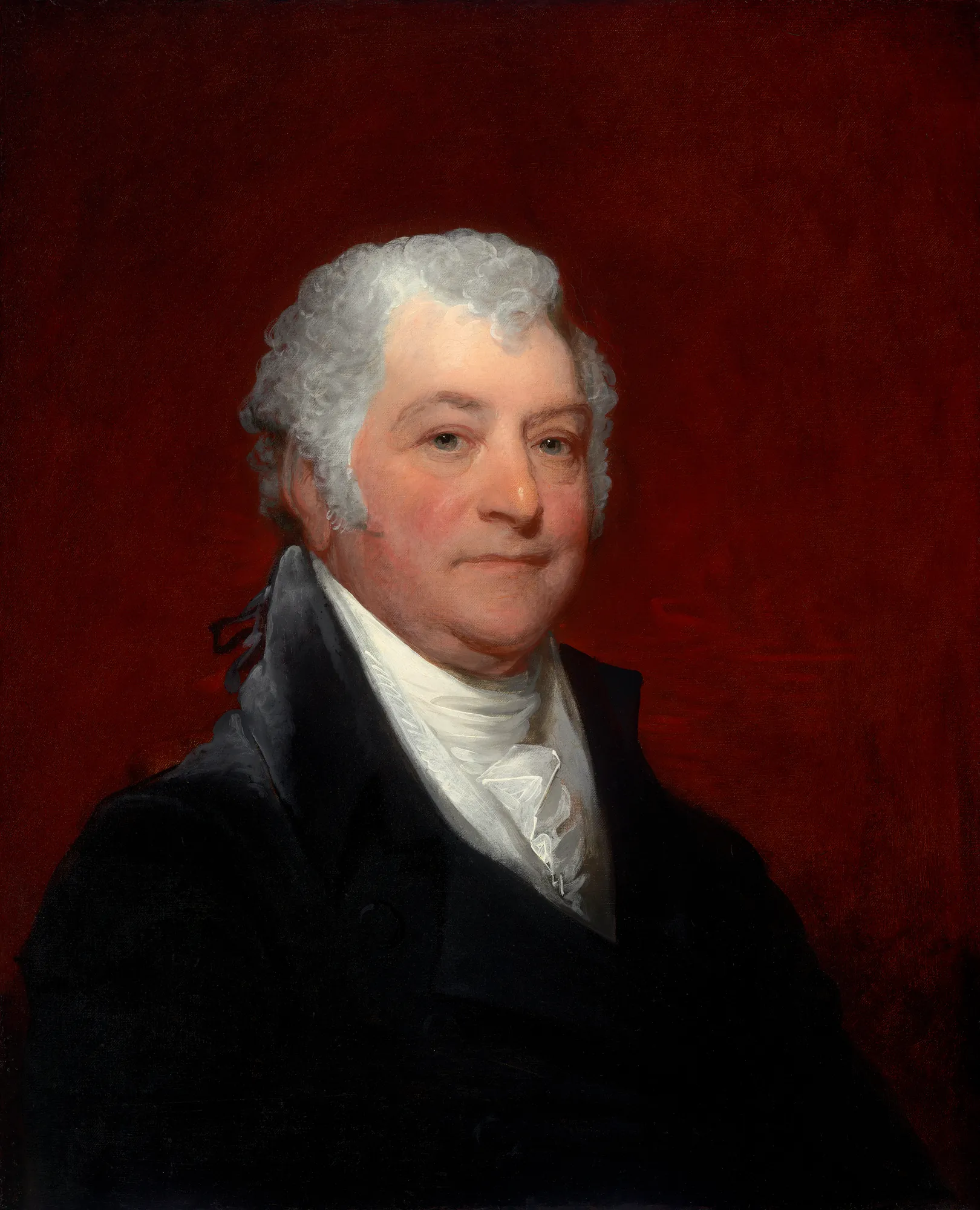 Joseph Coolidge Joseph Coolidge by Gilbert Stuart. A waist-up portrait of an older man with silver-white hair, wearing a dark coat and white cravat against a deep crimson background.