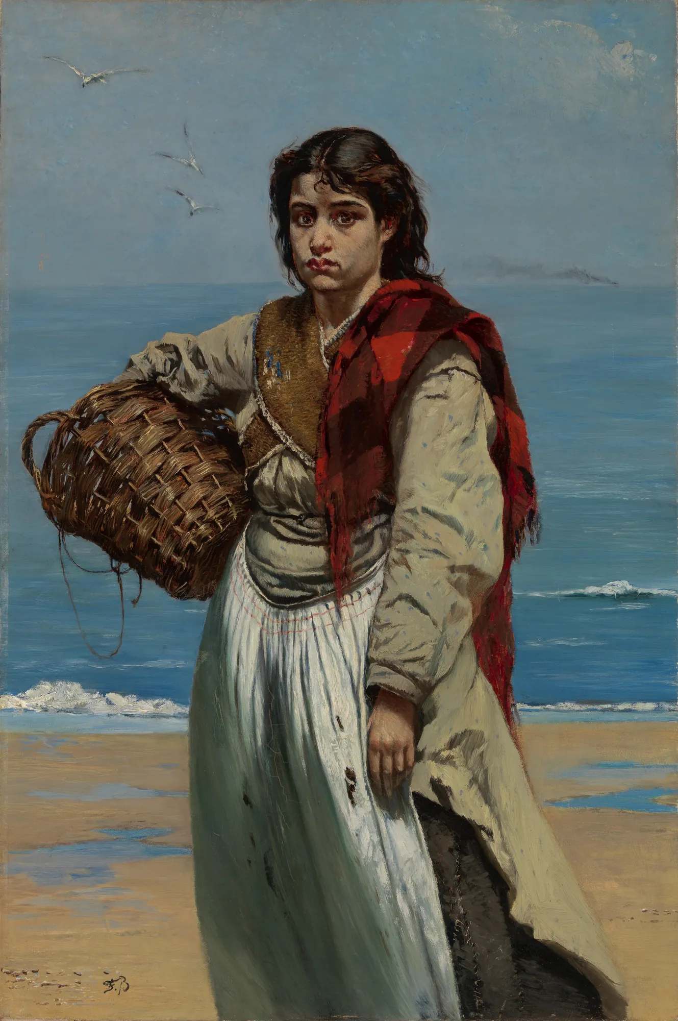 Junges Mädchen mit Korb am Meeresstrand