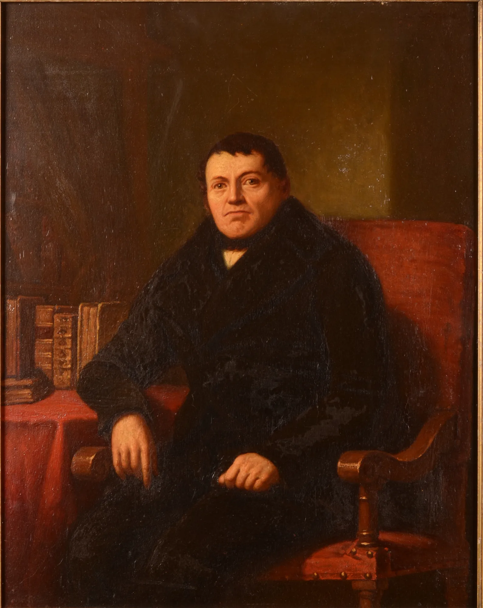 Portrait of an Unknown Man Portrait of an Unknown Man by Jacob de Bleyker (sr.). A formal oil portrait of a middle-aged man wearing a dark coat, seated in a red chair next to a desk with several large books.