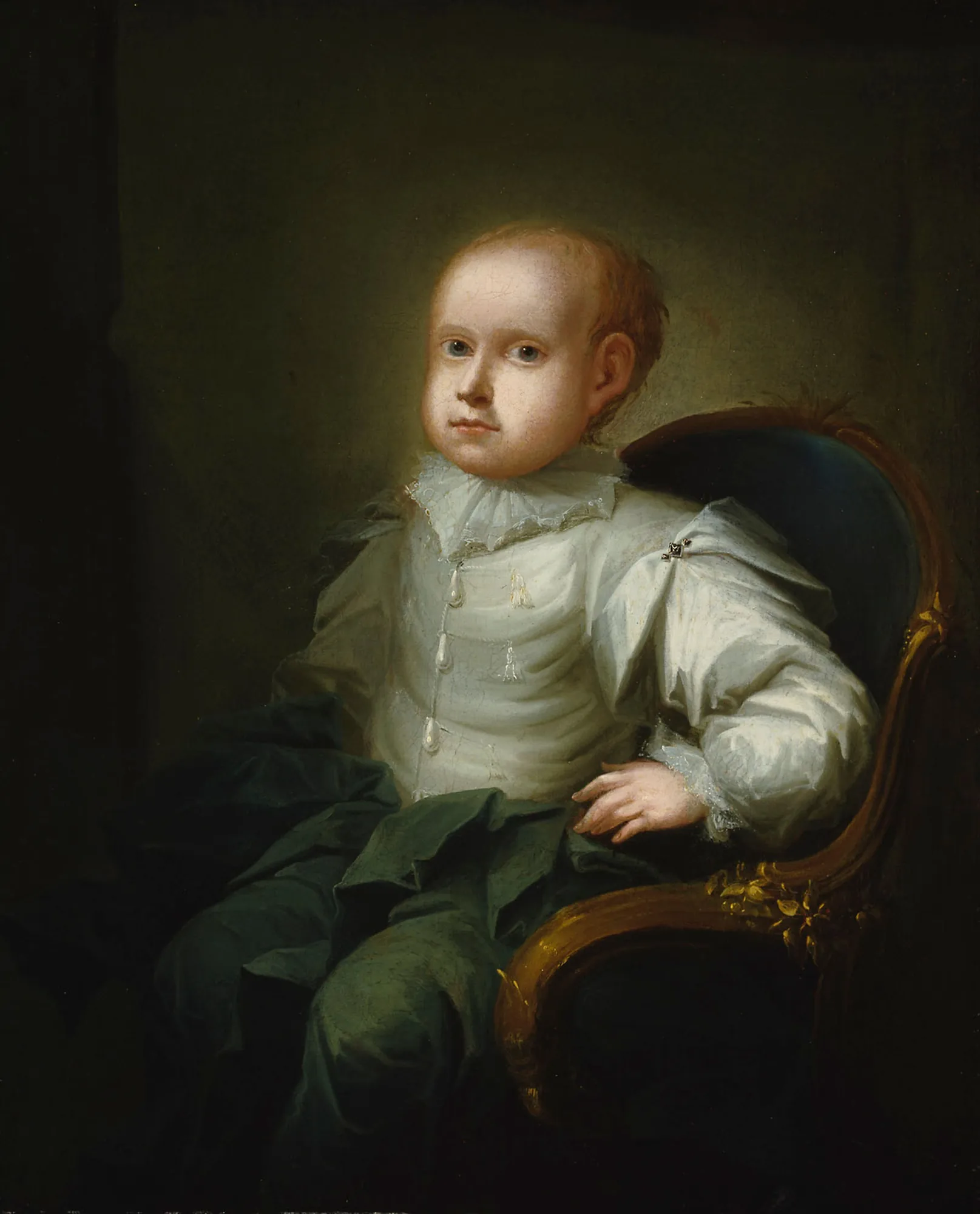 Isak Edvard Wacklin, the Artist's Son Isak Edvard Wacklin, the Artist's Son by Isak Wacklin. A formal portrait of a young boy with light hair wearing a voluminous white ruffled shirt and dark trousers, seated in a carved armchair against a dark green background.