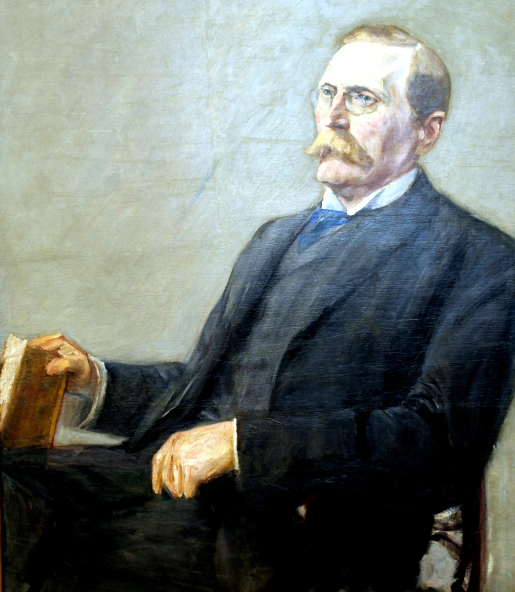 Portrait of Wilhelm von Bode Portrait of Wilhelm von Bode by Max Liebermann. An impressionistic oil portrait of a seated man with a mustache and glasses, wearing a dark suit and holding a book against a light neutral background.