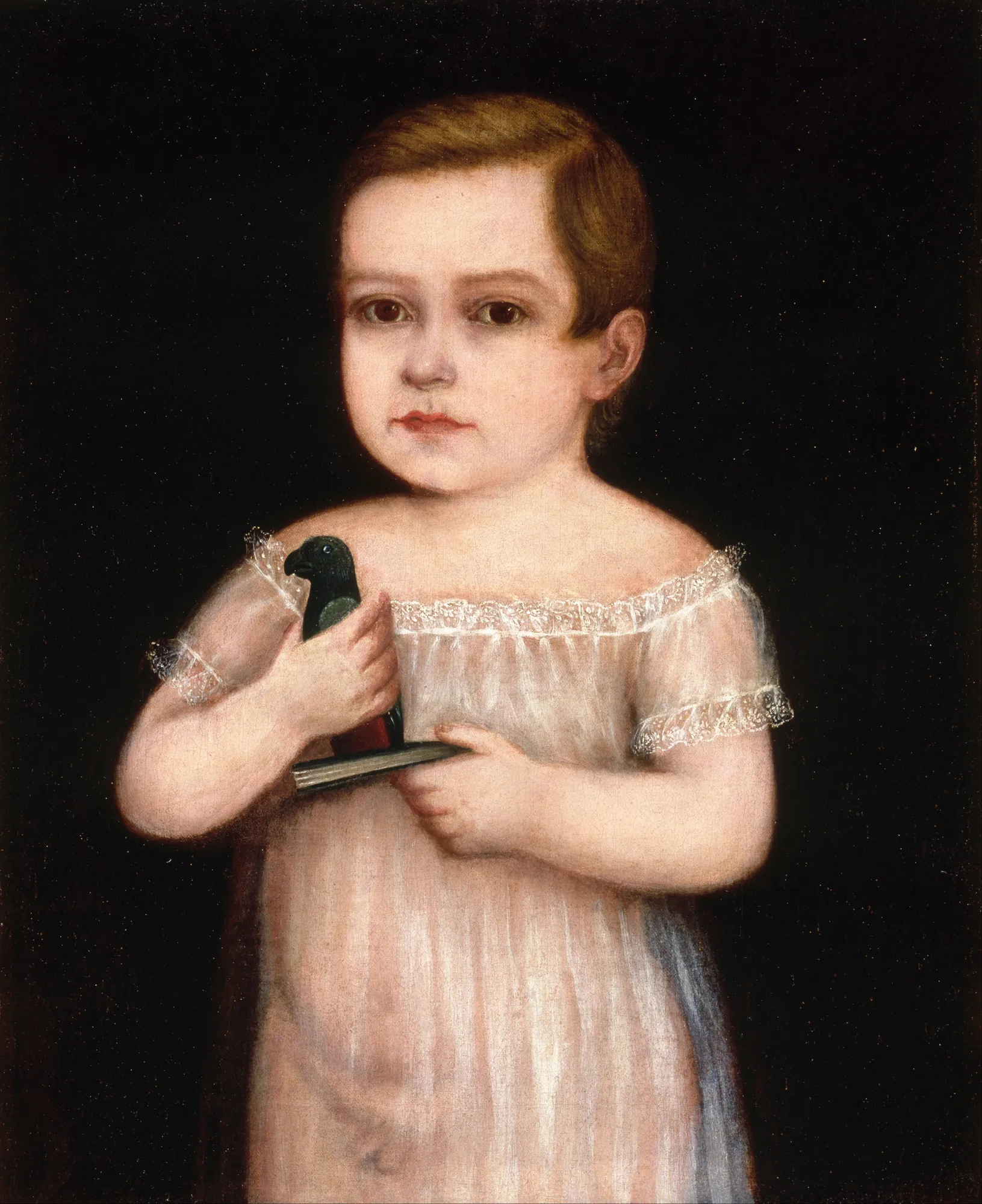Niño con Cotorra de Juguete