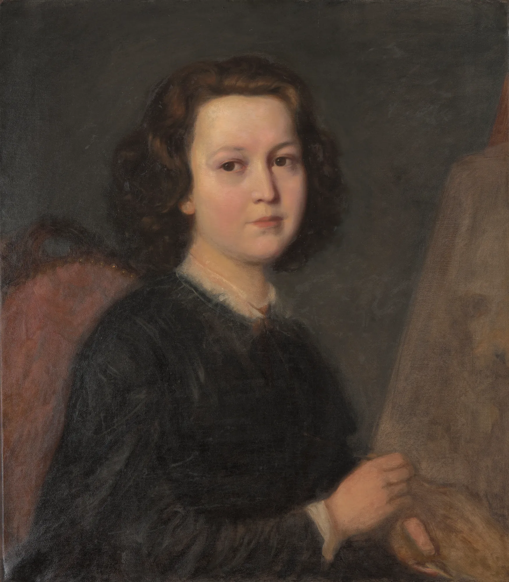Portrait of Józefa Geppert Portrait of Józefa Geppert by Aleksander Kotsis. A waist-up portrait of a woman with curly brown hair wearing a dark dress, seated next to an easel.