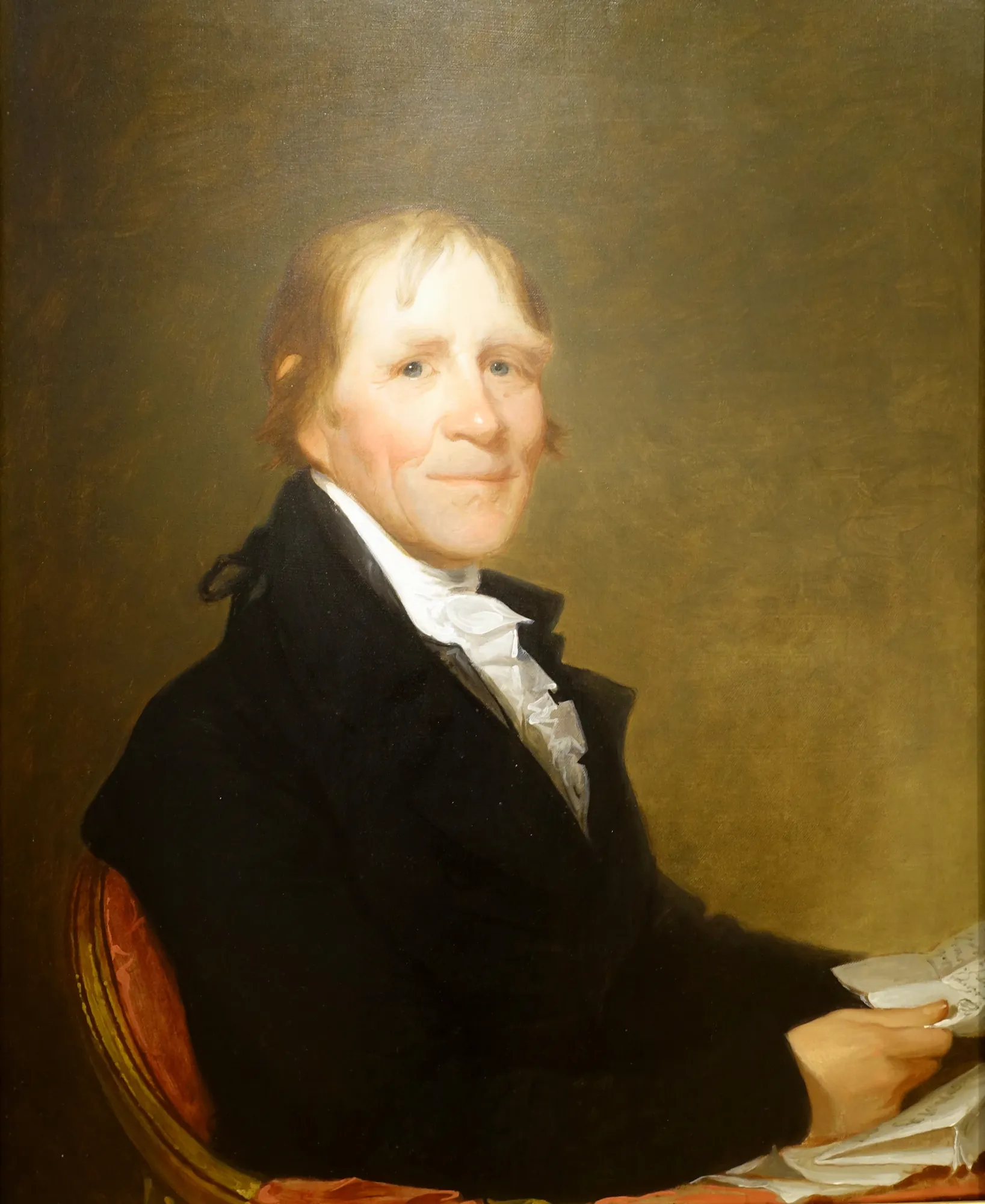 Portrait of William Gray Portrait of William Gray by Gilbert Stuart. A half-length portrait of a man in a black coat and white cravat, holding documents and seated in a red chair.