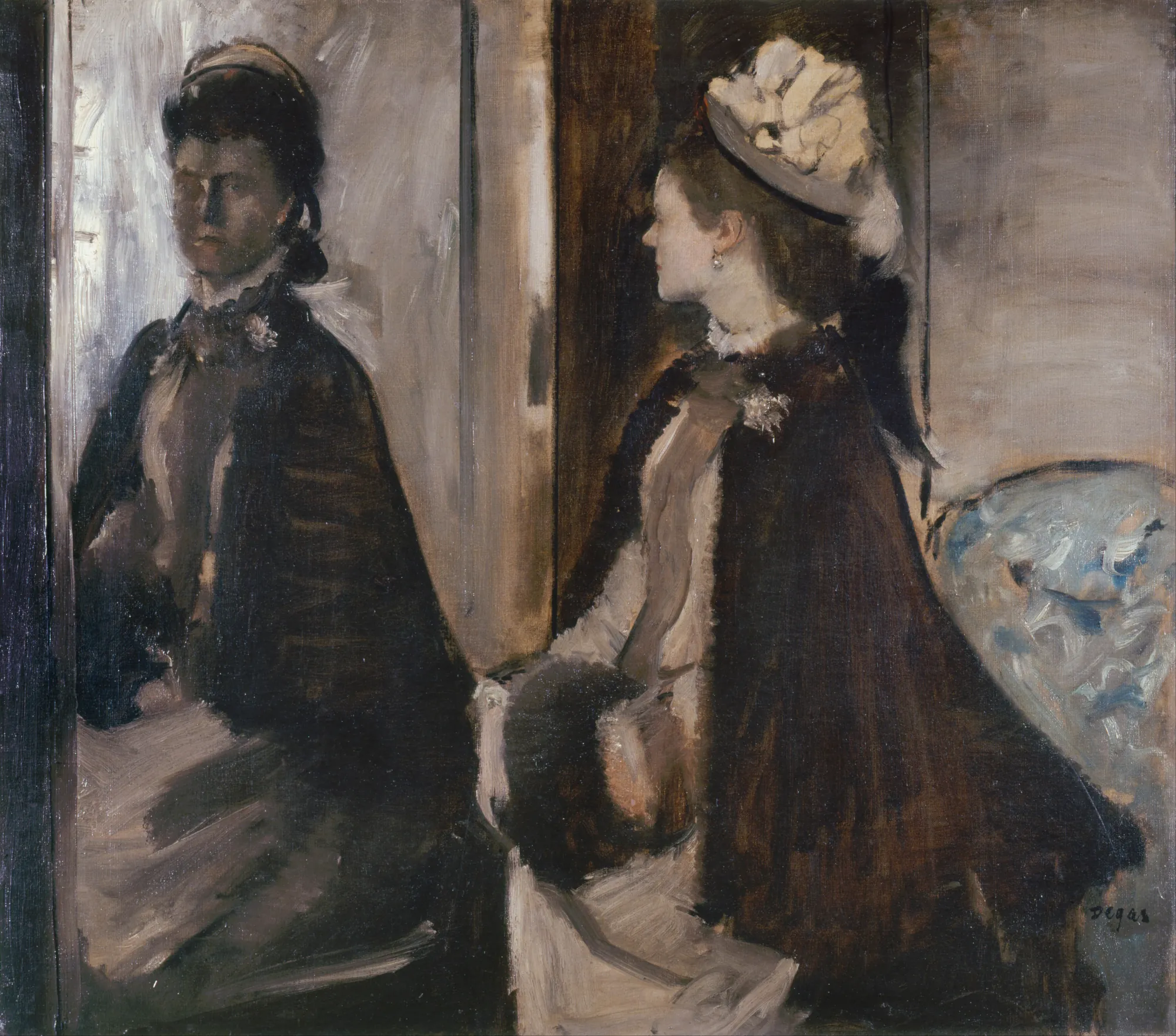 Mrs. Jeantaud in the Mirror Mrs. Jeantaud in the Mirror by Edgar Degas. A woman in a dark cloak and decorative hat is depicted in profile while her reflection gazes back from a large mirror on the left.