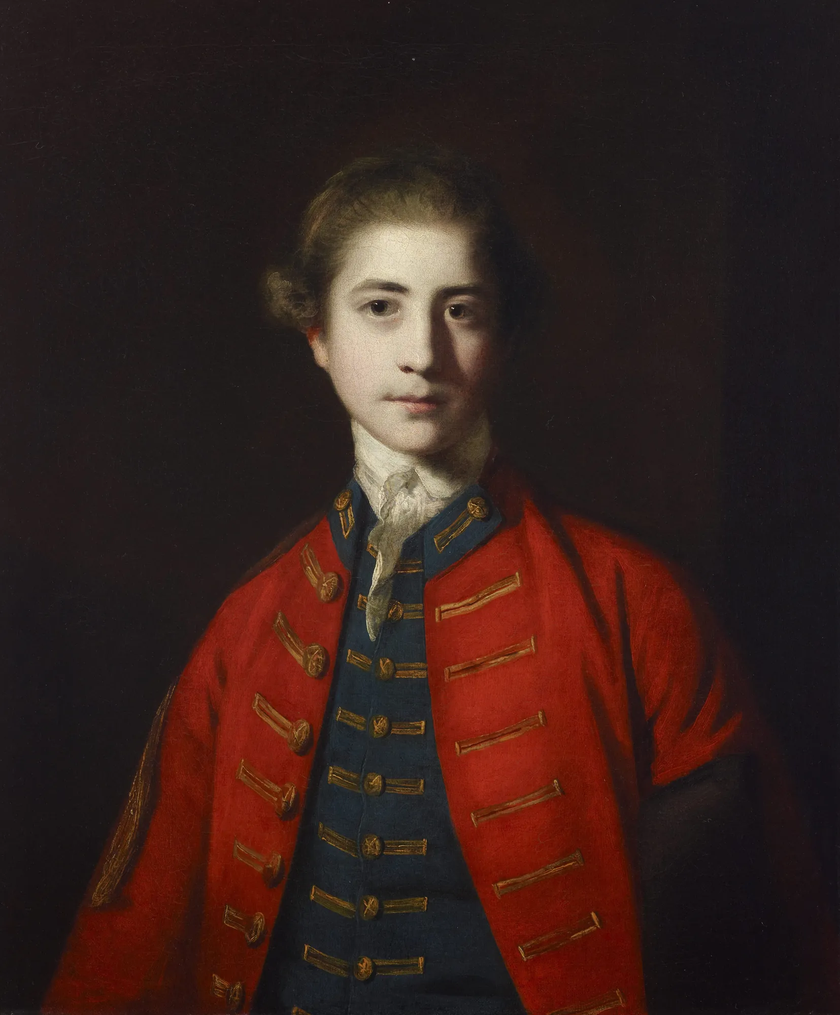 Stephen Croft, Junior Stephen Croft, Junior by Joshua Reynolds. A waist-length portrait of a young man with soft features, dressed in a vibrant red coat and blue waistcoat with gold trimmings against a dark, atmospheric background.