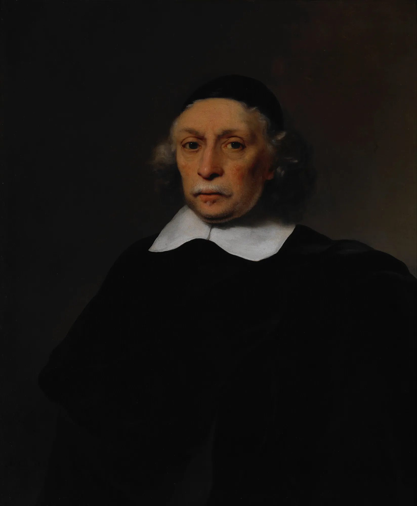 Portrait of a Scholar Portrait of a Scholar by Ferdinand Bol. A bust-length portrait of an elderly man with a white mustache and a skullcap, wearing a dark cloak and a wide white collar against a dark background.