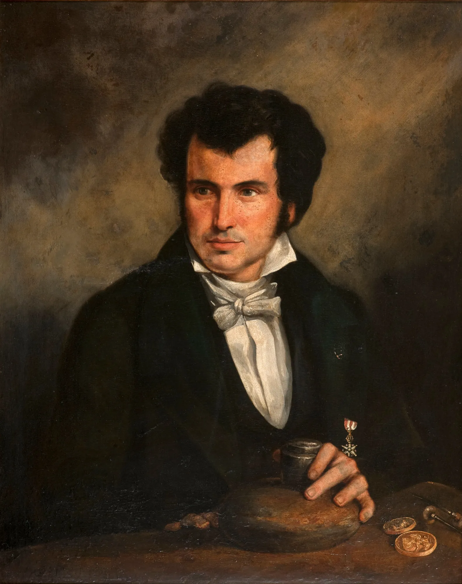 Portrait of Zepherin Ferrez Portrait of Zepherin Ferrez by Augusto Müller. A nineteenth-century oil portrait of a man with dark hair wearing a black coat and a crisp white cravat, his hand resting on a table with small objects.