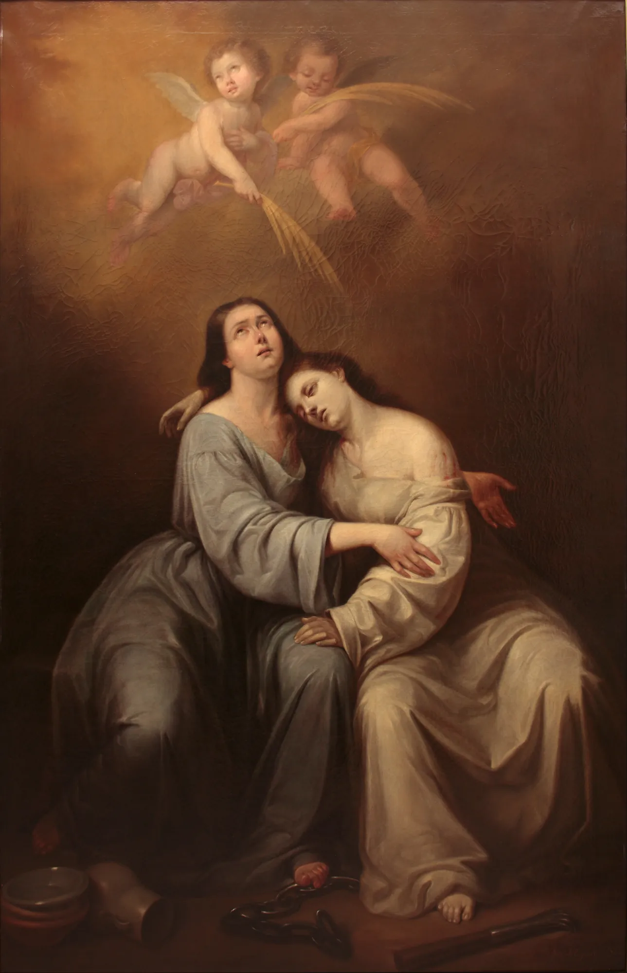 Saint Justa and Saint Rufina Saint Justa and Saint Rufina by Antonio María Esquivel. Two women in draped robes sit together in a somber, dimly lit setting while two cherubs hover above them in a golden light.