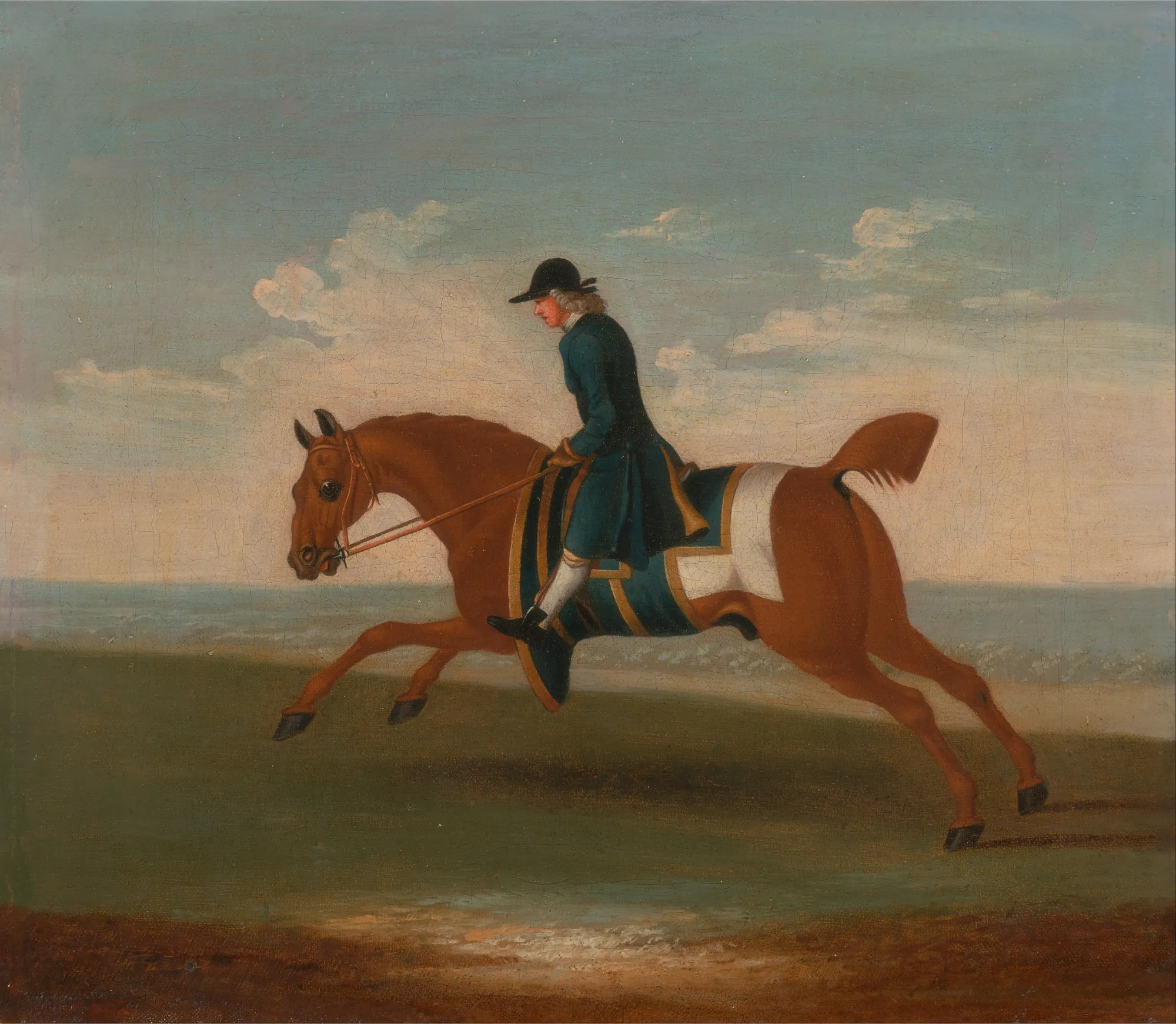 A Chestnut Racehorse Exercised by a Trainer