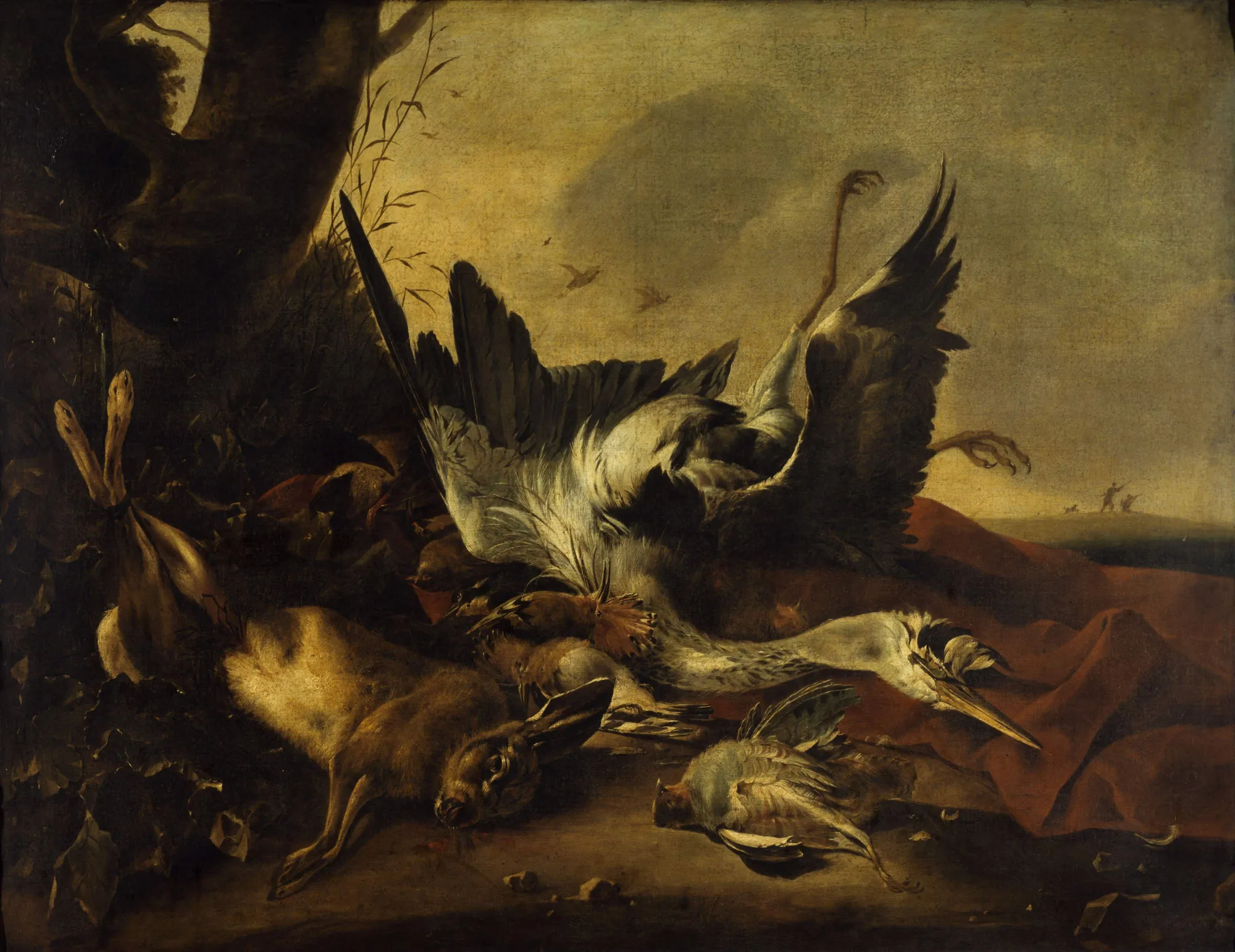 Etalage de Gibier Mort Etalage de Gibier Mort by Jan Baptist Weenix. A hunting still life featuring a hare and several birds arranged in an atmospheric landscape with a large tree and a distant hunting party.