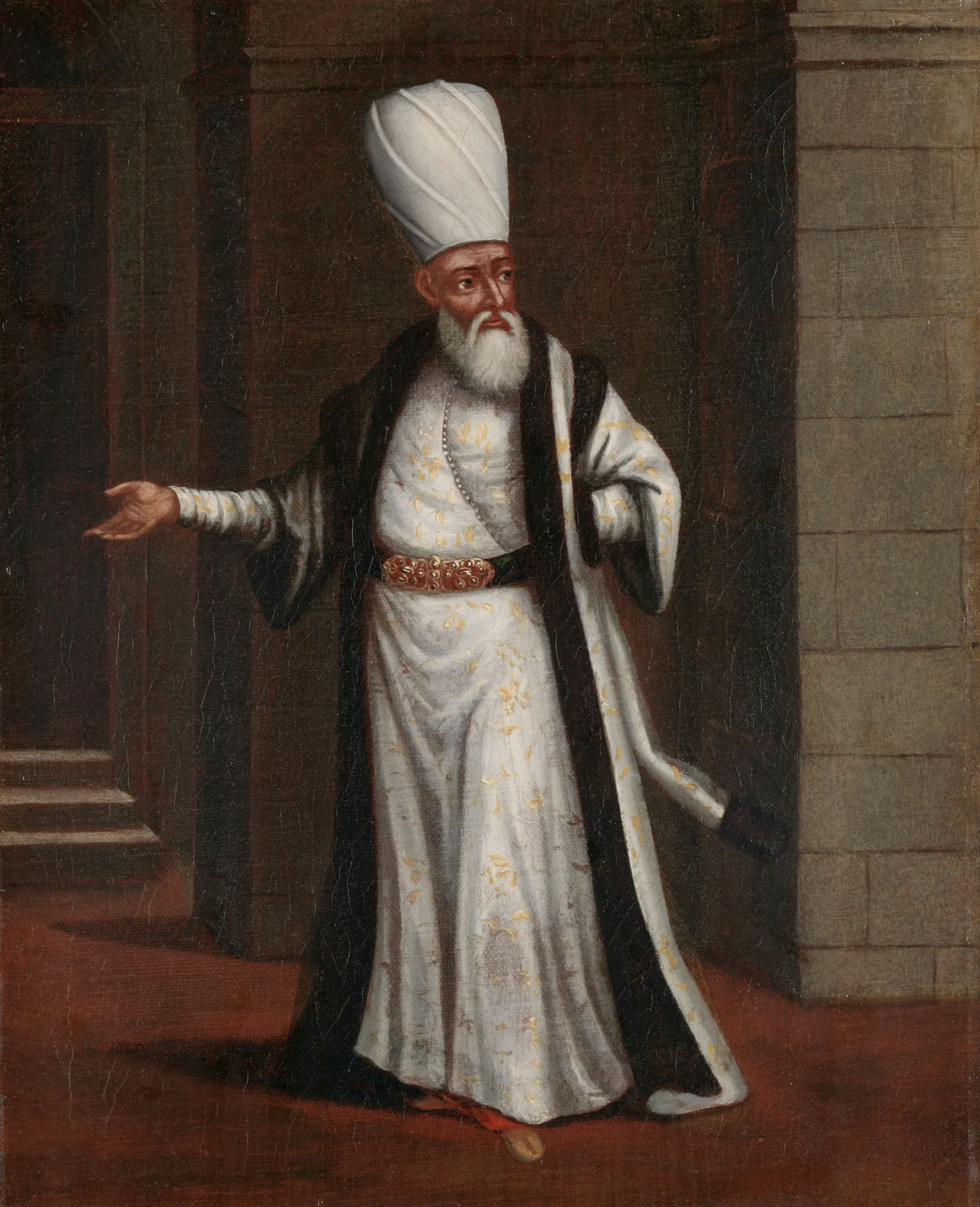 The Janissary Aga The Janissary Aga by Jean Baptiste Vanmour. A full-length portrait of a Janissary Aga in Ottoman attire, wearing a tall white turban and a fur-lined robe.